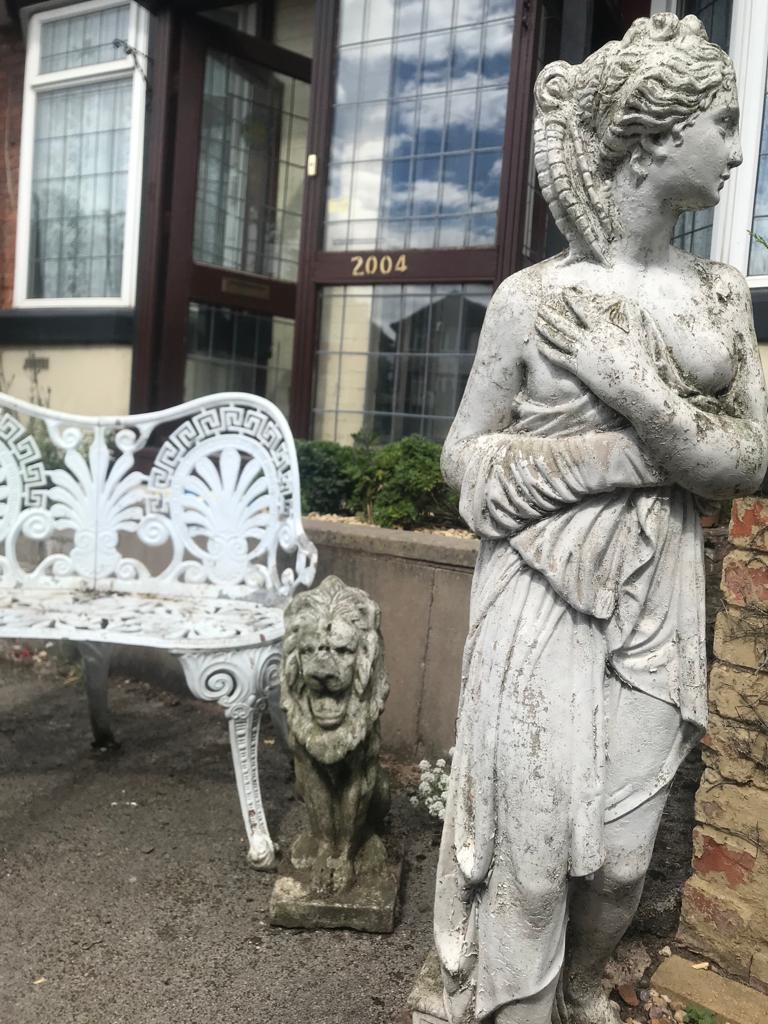 House clearance and garden tidy services. Garden bench and statues outside home in Sheldon, Birmingham.  Items are marked for removal and recycling.