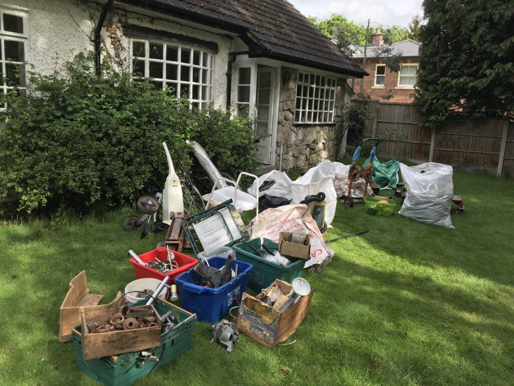 Berkeley House Clearance in Streetly Furniture and rubbish in front garden at property in Wood Lane Streetly. Rubbish sorted and waiting to be loaded on Terry's van.