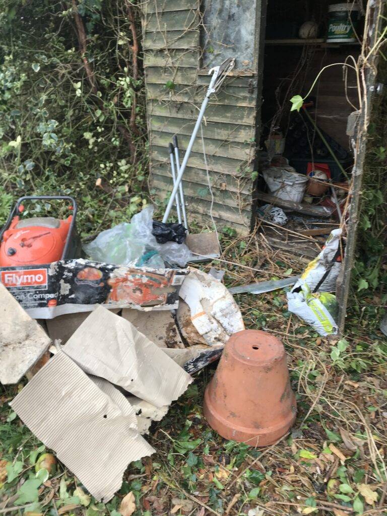 Garden pots and other waste in garden. Waste for removal and recycling. Berkeley House Clearance bereavement garden tidy up and shed clearance services Coleshill