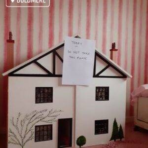 A dolls house in a bedroom at a home in Mere Green. Items marked to stay by customer. Berkeley House Clearance in Mere Green.