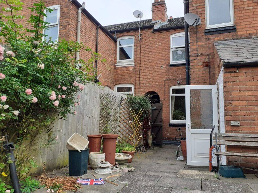 Back garden at a home in Erdington. Showing garden pots and items from shed that are ready to remove. Berkeley House Clearances. Our services in Birmingham.