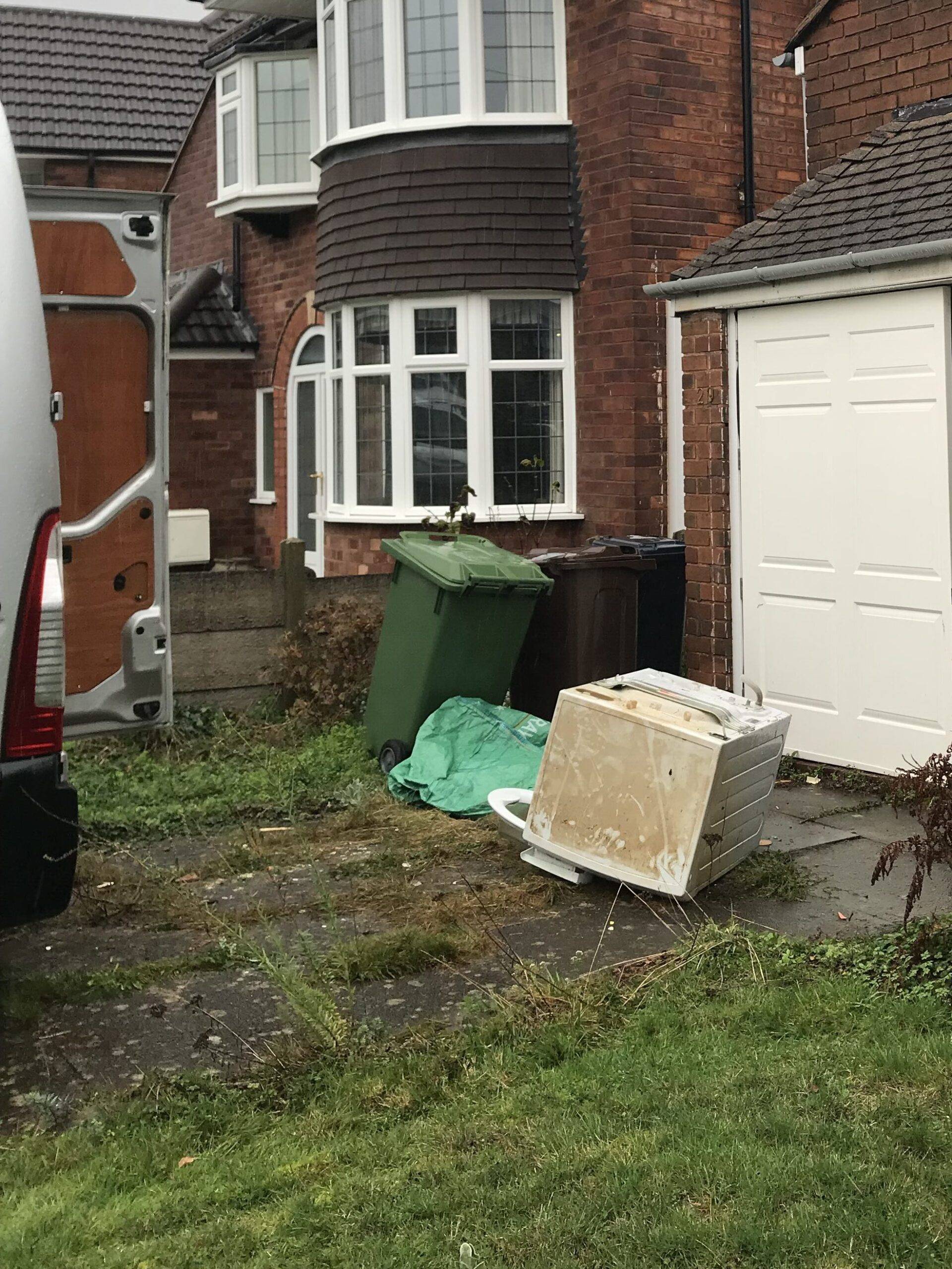 Cannock house clearance. Items outside home in Cannock ready to be loaded on van. Berkeley House Clearance services. 